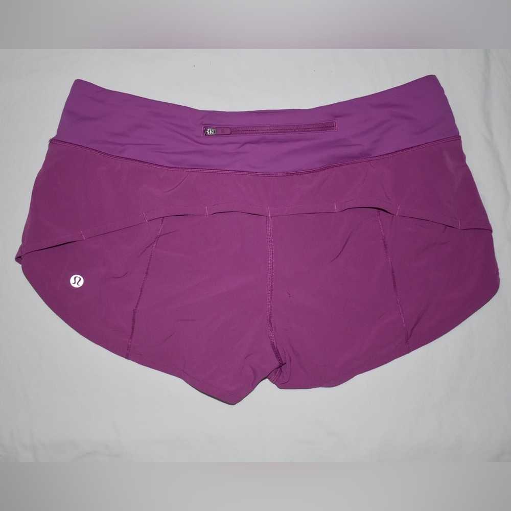 size 4 Lululemon Speed-Up Shorts in purple/pink.